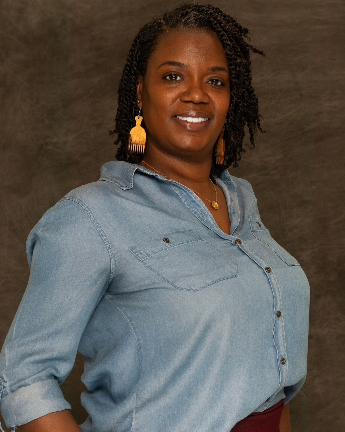Headshot of Adina McCollough, smiling and confident